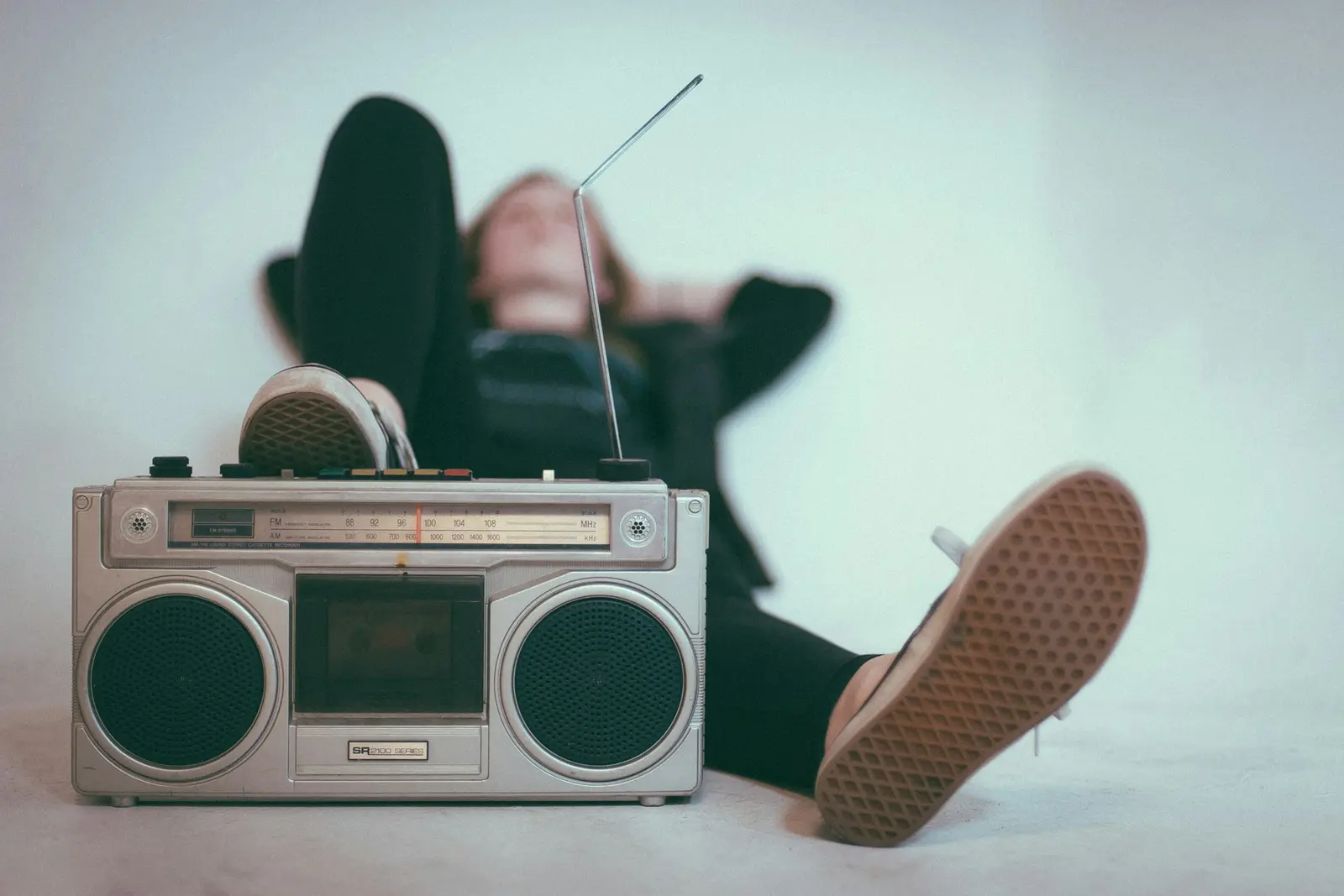 A vintage boombox on a white floor
